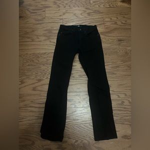 Black 5 pocket Denim Jeans. Brand is Vans.